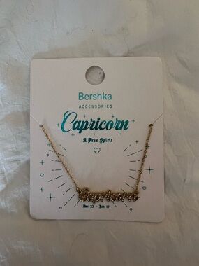 bershka capricorn gold tone necklace